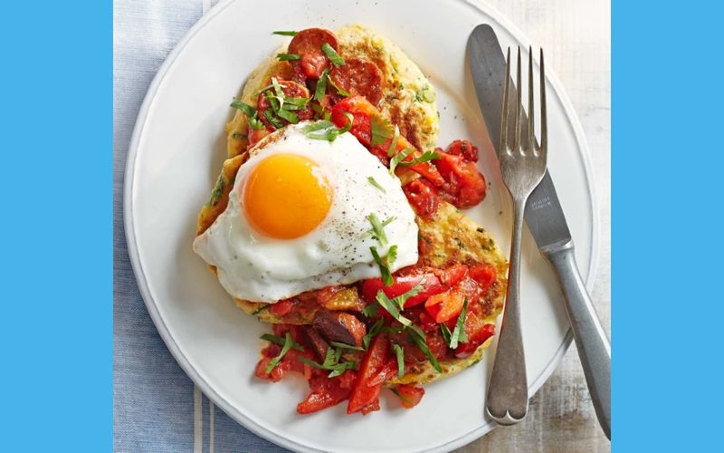 Sweetcorn pancakes with fried eggs and chorizo salsa